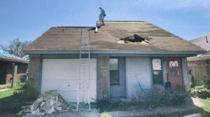 Climbing on a damages roof in South Florida 